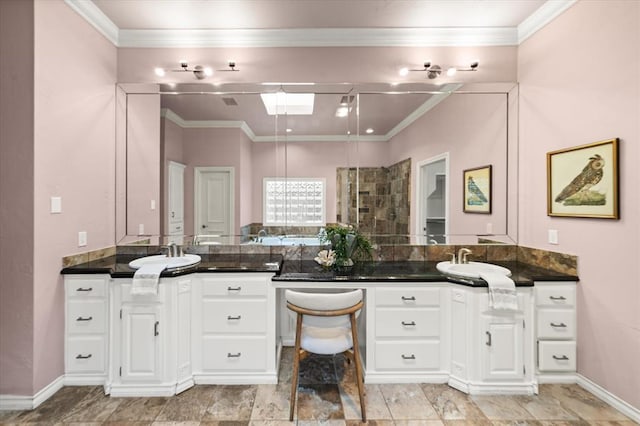 14705 Longford Way, Edmond, OK 73013 - bathroom with two vanities, crown molding, a tile shower, and baseboards