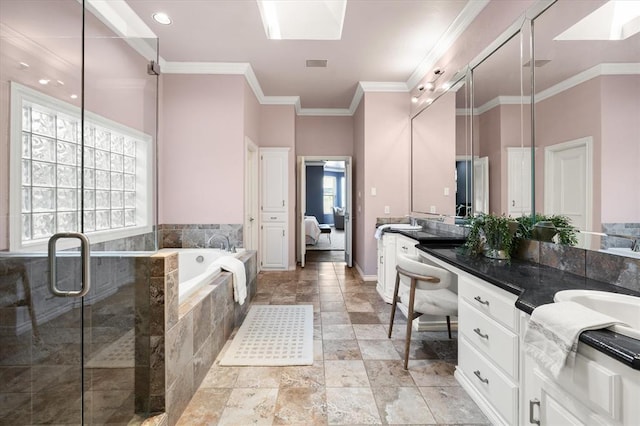 14705 Longford Way, Edmond, OK 73013 - ensuite bathroom featuring vanity, a bath, a stall shower, crown molding, and stone finish flooring
