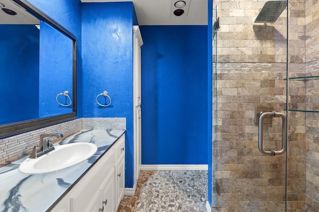 14705 Longford Way, Edmond, OK 73013 - full bathroom with vanity, a shower stall, tile patterned floors, and decorative backsplash