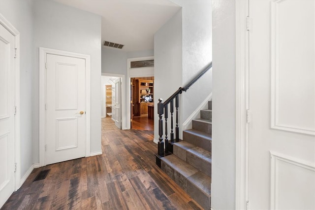 14705 Longford Way, Edmond, OK 73013 - foyer with wood finished floors, stairway, and baseboards