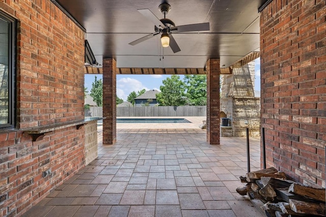 14705 Longford Way, Edmond, OK 73013 - fenced backyard with ceiling fan and a patio area