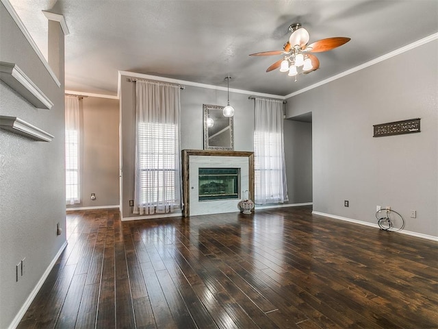 13005 Willowcrest Ln, Oklahoma City, OK 73170 - unfurnished living room with ceiling fan, baseboards, crown molding, hardwood / wood-style flooring, and a glass covered fireplace