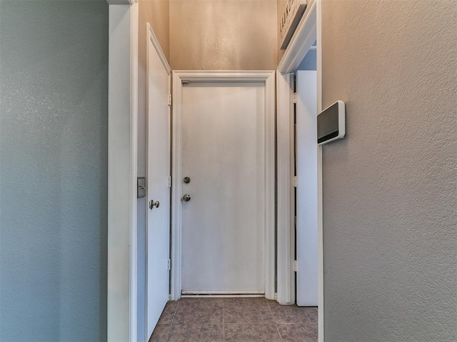 13005 Willowcrest Ln, Oklahoma City, OK 73170 - hallway featuring a textured wall and tile patterned flooring