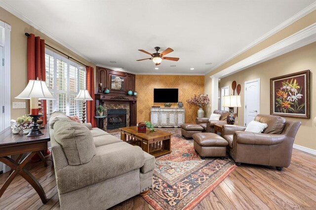 910744 S 3440th Rd, Chandler, OK 74834 - living room with ceiling fan, light wood-type flooring, a fireplace, crown molding, and recessed lighting