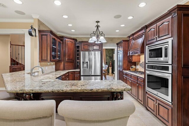 910744 S 3440th Rd, Chandler, OK 74834 - kitchen with stainless steel appliances, a peninsula, recessed lighting, a chandelier, and custom exhaust hood