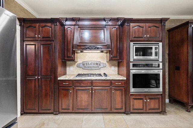 910744 S 3440th Rd, Chandler, OK 74834 - kitchen featuring stainless steel appliances, light tile patterned flooring, light stone counters, decorative backsplash, and ornamental molding