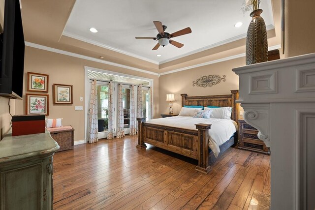 910744 S 3440th Rd, Chandler, OK 74834 - bedroom with hardwood / wood-style floors, a raised ceiling, crown molding, baseboards, and recessed lighting