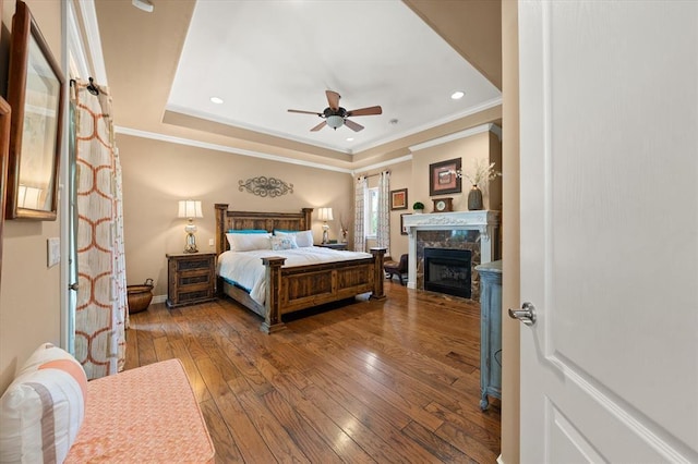 910744 S 3440th Rd, Chandler, OK 74834 - bedroom featuring hardwood / wood-style floors, crown molding, a fireplace, recessed lighting, and baseboards