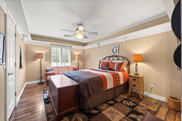 910744 S 3440th Rd, Chandler, OK 74834 - bedroom with baseboards, wood-type flooring, and a ceiling fan