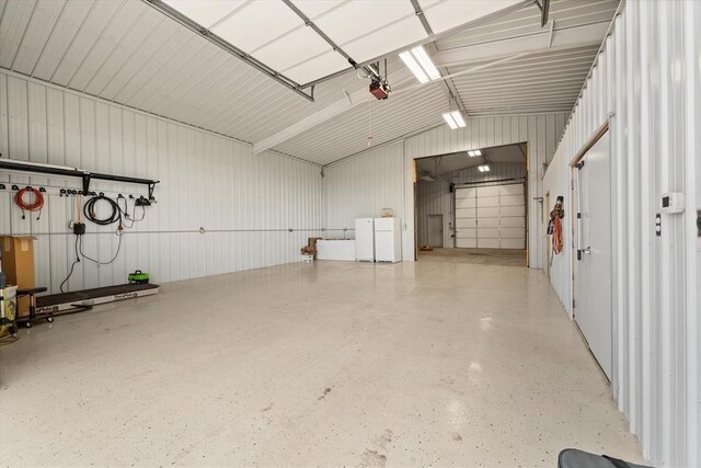 910744 S 3440th Rd, Chandler, OK 74834 - garage with a garage door opener and metal wall