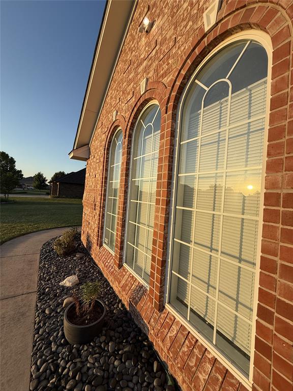 1030 Belmonte Ct, Yukon, OK 73099 - exterior view of brick siding