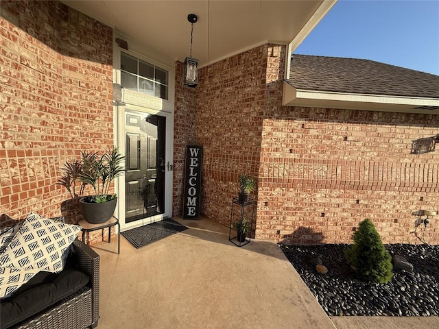 1030 Belmonte Ct, Yukon, OK 73099 - entrance to property featuring brick siding and a shingled roof