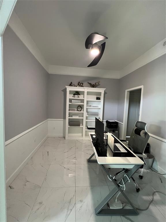 1030 Belmonte Ct, Yukon, OK 73099 - home office with light marble finish flooring and baseboards