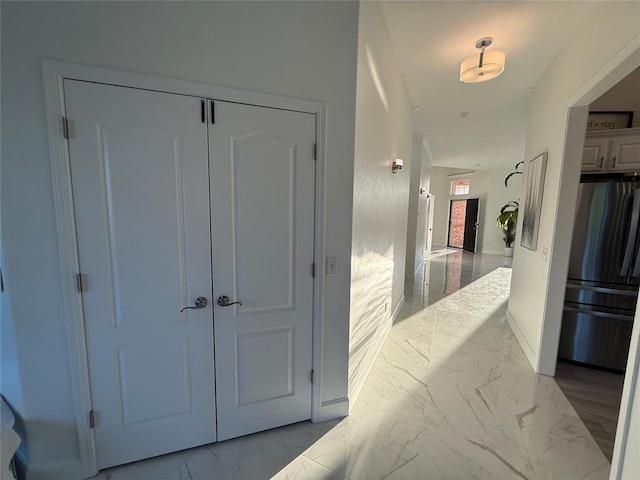 1030 Belmonte Ct, Yukon, OK 73099 - hallway featuring marble tiled flooring and baseboards