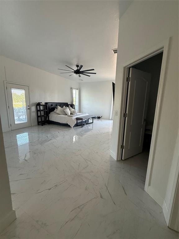 1030 Belmonte Ct, Yukon, OK 73099 - bedroom featuring multiple windows, light marble finish flooring, and baseboards
