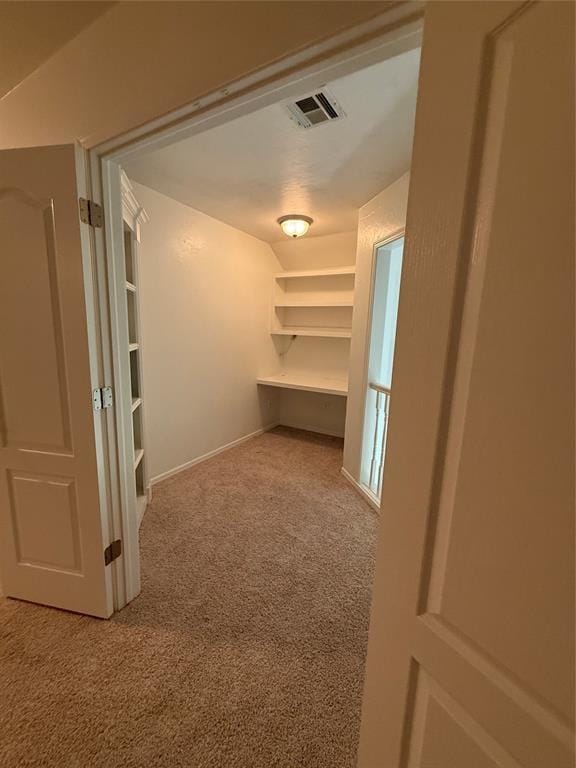 1030 Belmonte Ct, Yukon, OK 73099 - hallway featuring carpet floors and baseboards