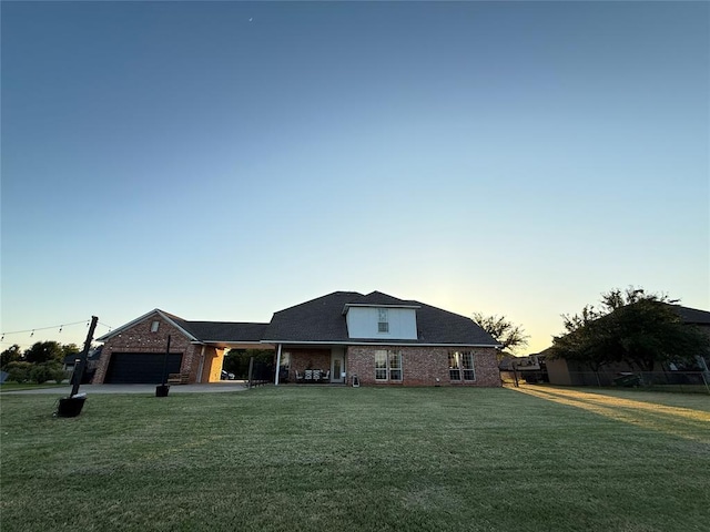 1030 Belmonte Ct, Yukon, OK 73099 - view of front of property featuring a garage and brick siding