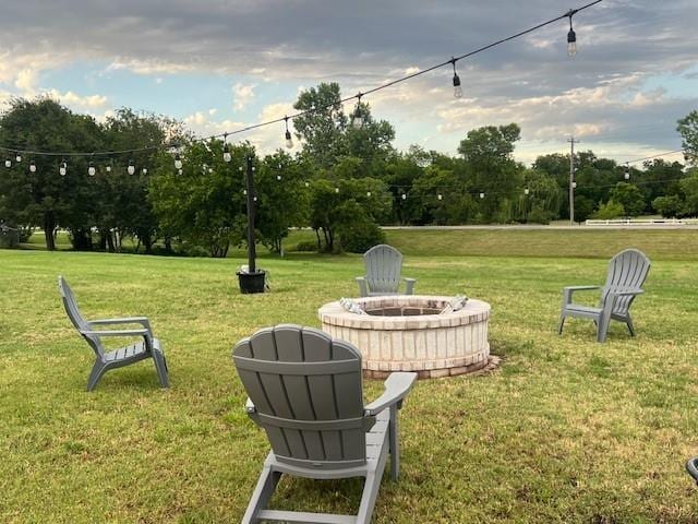 1030 Belmonte Ct, Yukon, OK 73099 - view of grassy yard featuring an outdoor fire pit