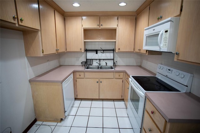 6414 Galaxie Ter, Oklahoma City, OK 73132 - kitchen featuring white appliances, a sink, decorative backsplash, light countertops, and light tile patterned flooring