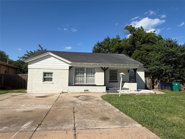 3208 N Roff Ave, Oklahoma City, OK 73112 - ranch-style house featuring brick siding, covered porch, and a shingled roof