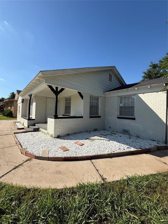 3208 N Roff Ave, Oklahoma City, OK 73112 - rear view of house featuring brick siding and a porch