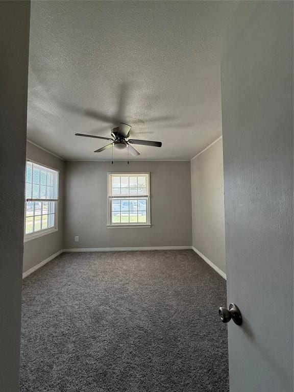 3208 N Roff Ave, Oklahoma City, OK 73112 - spare room featuring healthy amount of natural light, a textured ceiling, ceiling fan, carpet floors, and baseboards