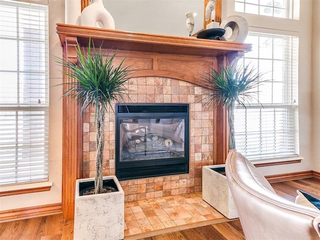 2508 Hamden Ave, Norman, OK 73069 - detailed view of baseboards, wood finished floors, and a fireplace