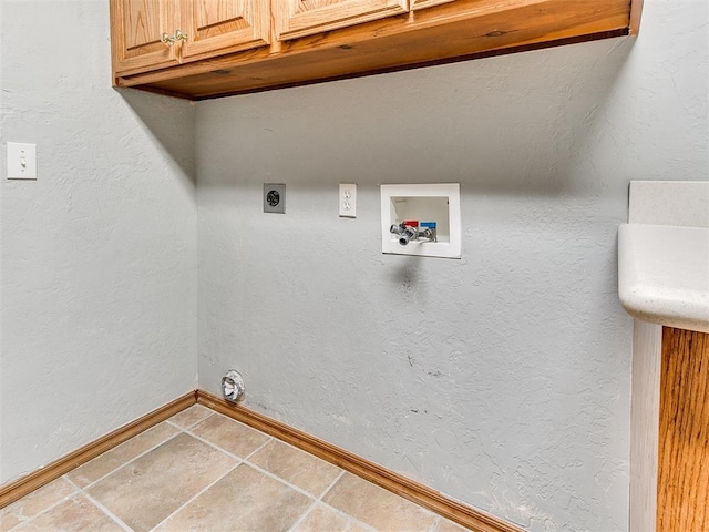 2508 Hamden Ave, Norman, OK 73069 - laundry area featuring electric dryer hookup, cabinet space, hookup for a washing machine, baseboards, and tile patterned flooring