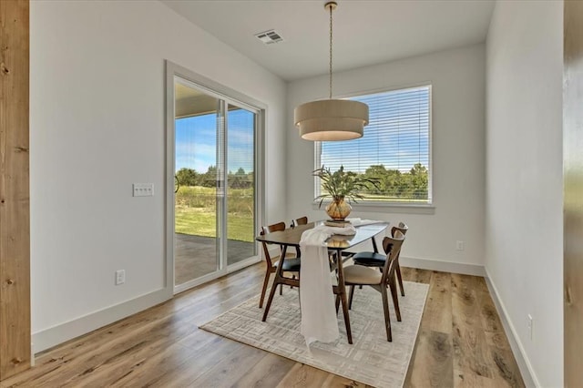 5617 NW 155th St, Edmond, OK 73013 - dining room featuring light wood-style floors and baseboards