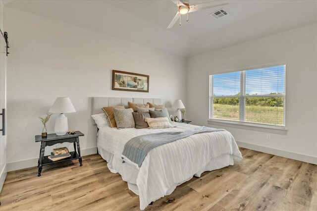 5617 NW 155th St, Edmond, OK 73013 - bedroom featuring light wood-style flooring, baseboards, and a ceiling fan