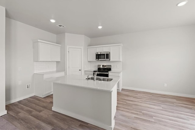 5201 Grassland Dr, Guthrie, OK 73044 - kitchen with stainless steel appliances, backsplash, a sink, light countertops, and recessed lighting