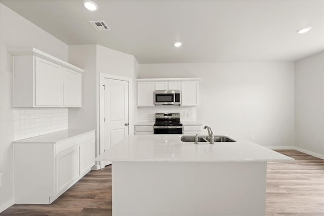 5201 Grassland Dr, Guthrie, OK 73044 - kitchen featuring appliances with stainless steel finishes, a sink, baseboards, decorative backsplash, and recessed lighting