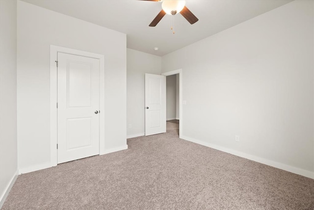 5201 Grassland Dr, Guthrie, OK 73044 - unfurnished bedroom with carpet, baseboards, and a ceiling fan