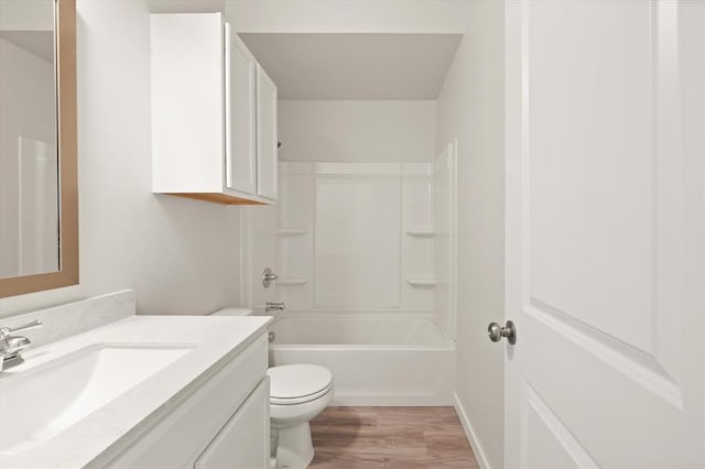 5201 Grassland Dr, Guthrie, OK 73044 - bathroom featuring toilet, wood finished floors, vanity, and  shower combination