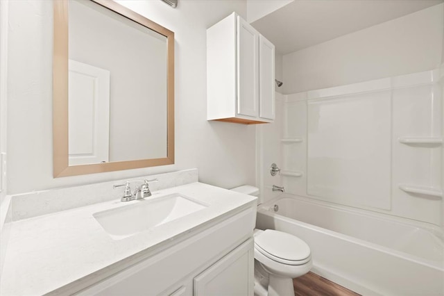 5201 Grassland Dr, Guthrie, OK 73044 - bathroom with vanity, toilet, shower / bathtub combination, and wood finished floors