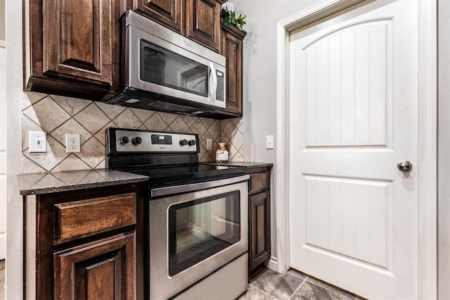 11444 NW 131st St, Piedmont, OK 73078 - kitchen featuring stainless steel appliances, dark brown cabinets, backsplash, and dark stone countertops