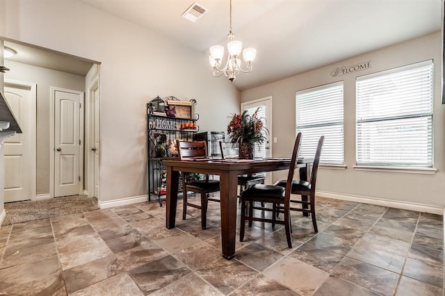11444 NW 131st St, Piedmont, OK 73078 - dining area featuring a chandelier, lofted ceiling, stone finish floors, and baseboards
