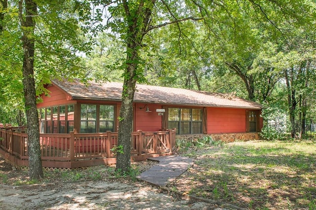 143 Robinson Ln, Ardmore, OK 73401 - view of front of property with a deck and a shingled roof
