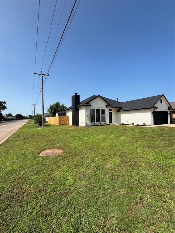 10501 Reiter Dr, Midwest City, OK 73130 - view of home's exterior featuring a chimney