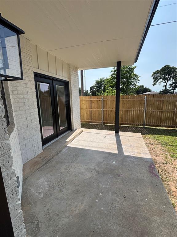 10501 Reiter Dr, Midwest City, OK 73130 - view of patio / terrace with french doors