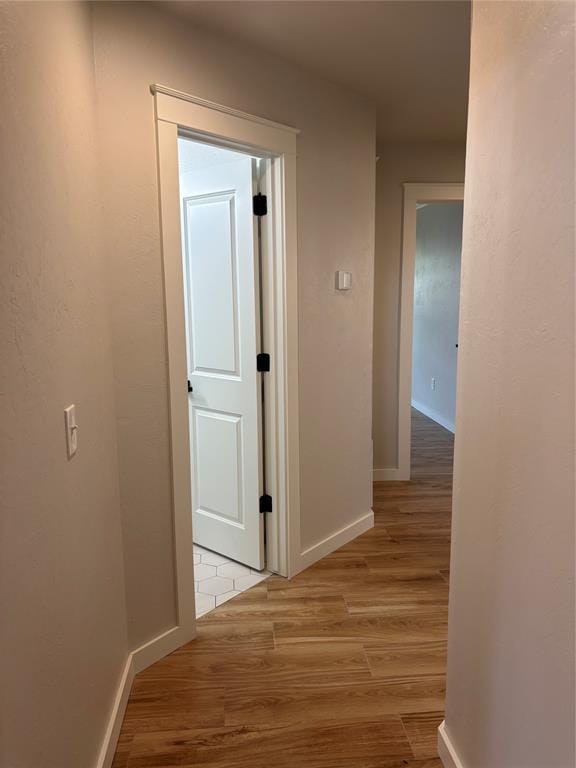 10501 Reiter Dr, Midwest City, OK 73130 - hall with light wood-type flooring and baseboards