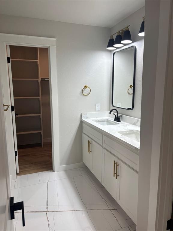 10501 Reiter Dr, Midwest City, OK 73130 - bathroom featuring double vanity and baseboards