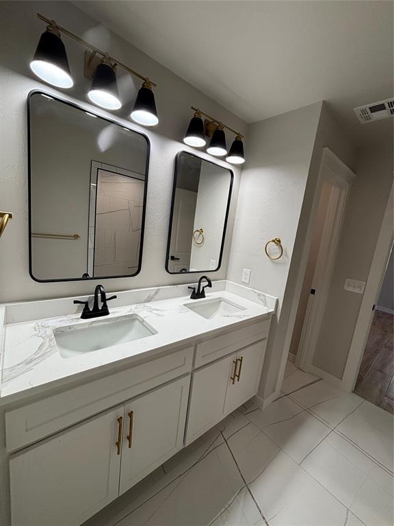 10501 Reiter Dr, Midwest City, OK 73130 - bathroom with double vanity