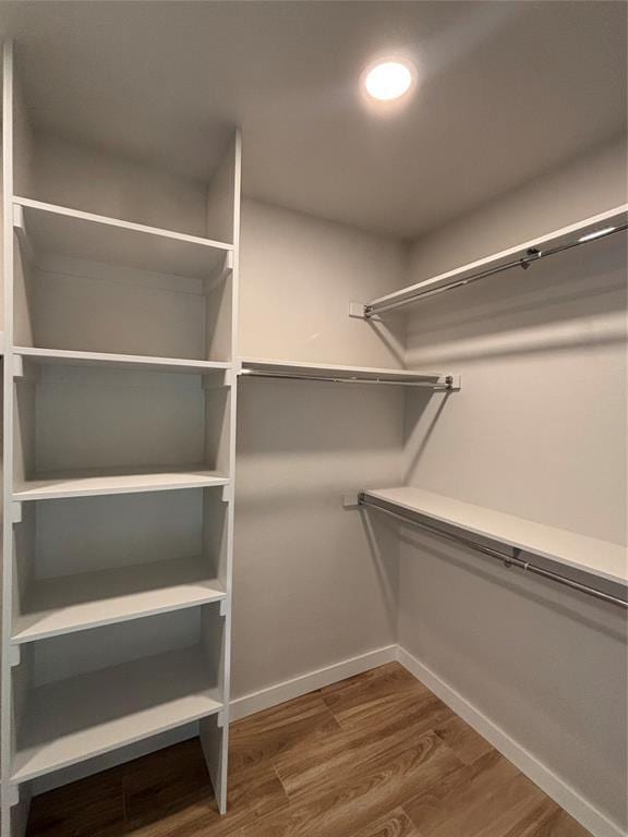 10501 Reiter Dr, Midwest City, OK 73130 - spacious closet featuring wood finished floors