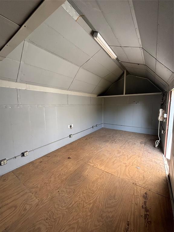 10501 Reiter Dr, Midwest City, OK 73130 - additional living space with vaulted ceiling