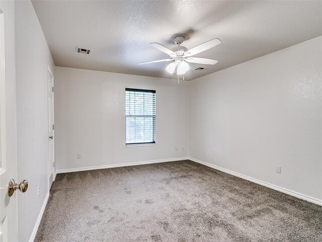 105 Taos, Edmond, OK 73013 - unfurnished room featuring carpet flooring, ceiling fan, and a textured ceiling