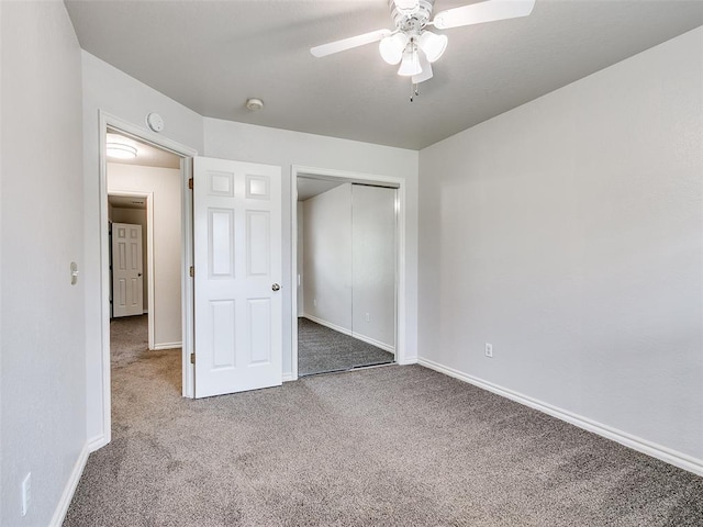 105 Taos, Edmond, OK 73013 - unfurnished bedroom featuring carpet, a closet, and ceiling fan