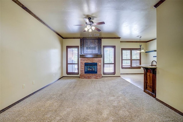 811 W Abi Rd, Washington, OK 73093 - unfurnished living room featuring light colored carpet, ornamental molding, baseboards, ceiling fan, and a fireplace