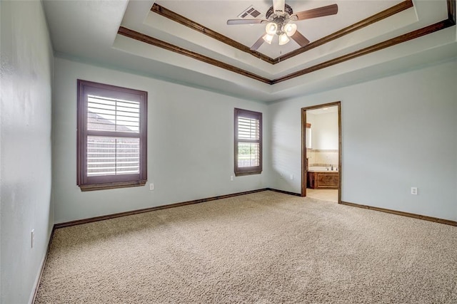 811 W Abi Rd, Washington, OK 73093 - unfurnished room with a tray ceiling, ornamental molding, light carpet, ceiling fan, and baseboards