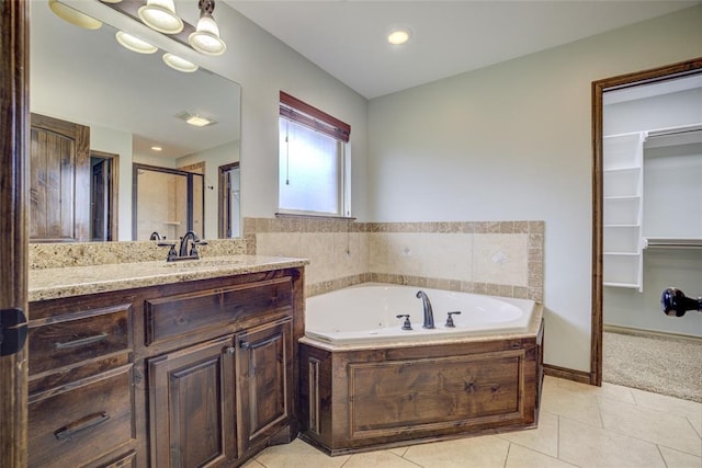 811 W Abi Rd, Washington, OK 73093 - bathroom with tile patterned floors, a stall shower, a tub with jets, and vanity